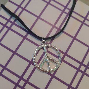 Hammered metal peace sign necklace